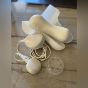 Clarisonic Mia 2, complete with travel case, brush cover, and charger cord.